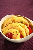 Pineapple carpaccio with sliced strawberries