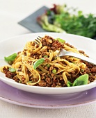 Quorn bolognese with tagliatelle, peas and basil