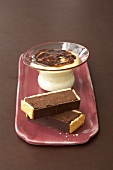 Chocolate truffle slices with biscuit crust, vanilla cream