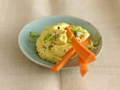 Mango and saffron dip with spring onions and carrot sticks