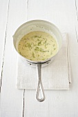 Hollandaise sauce with fennel in a saucepan