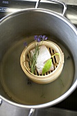 Cod with bay leaf & lavender in bamboo basket with liquid