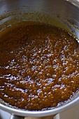 Caramel cooking in a sauteuse