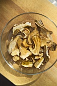 Sliced, dried ceps in a glass dish