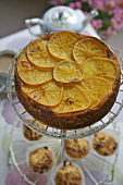 Orange almond cake and muffins on a tiered stand (UK)