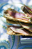 Aubergine cream and ham on bread