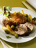 Braised guinea fowl leg with stuffing and olives