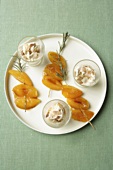 Fried apricots on rosemary skewers with almond parfait