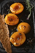 Peaches braised in acacia honey with lavender, nut wafer