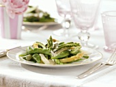 Steamed white and green asparagus with beans