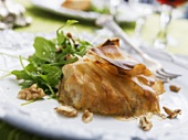Pear and Gorgonzola in pastry with rocket and walnuts