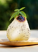 Poached pear filled with chocolate sauce