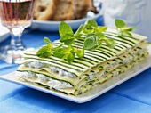 Herb soft cheese and courgette lasagne with mint leaves