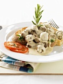 Button mushrooms in cream sauce on toasted white bread