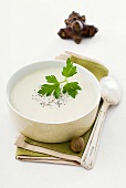 Jerusalem artichoke soup with parsley in a bowl