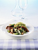Marinated, grilled duck with vegetables and spinach pasta
