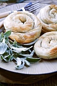 Baked filo pastry coils filled with spinach and feta