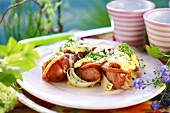 Fried sausages with onions & tomato & toasted cheese topping