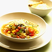 A plate of minestrone with noodles