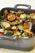 Baked vegetables with rosemary in a roasting tin