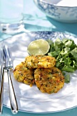 Three coriander potato cakes with chilli and lime