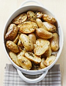 Roast potatoes with thyme in a baking dish