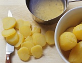 Whole and sliced potatoes, dressing for potato salad