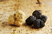 One Alba truffle and four Périgord truffles