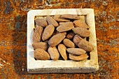 Bitter almonds on a stone slab