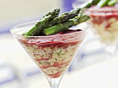 Whelks with beetroot and green asparagus in a glass