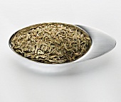 Cumin in a small metal dish