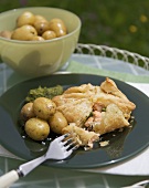 Salmon en croûte with potatoes and watercress & pea puree