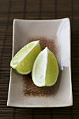 Lime wedges on a ceramic plate