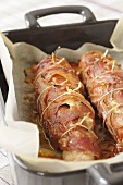 Ham-wrapped chicken roulades in a roasting tin