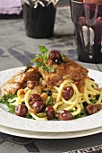 Braised veal with sour cherries and pistachios on noodles