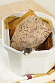 Rabbit terrine with jelly in a terrine dish