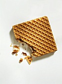 A filled wafer biscuit with a bite taken