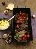 Braised beef with tomatoes in a roasting tin, polenta