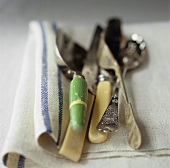 Old cutlery on a linen cloth