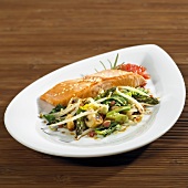 Fried salmon on pak choi, mushrooms, bacon, sprouts