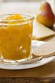 Mango & ginger chutney in a jar with oat biscuit, cheese, pear