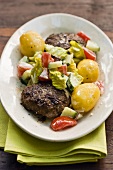 Burgers with potatoes and salad