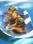 Smoked salmon and cucumber sandwiches in black bread