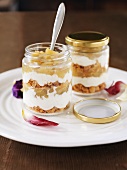 Apple compote, biscuits & vanilla cream in layers in jars