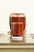 Upturned jars of tomato and blackberry compote