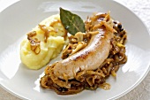 Sausage and mash with onion and juniper berry sauce