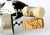 Real and plastic corks on corkscrews