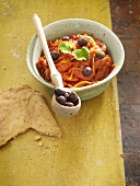 Peppers and onions with olives and flatbread