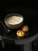 A bowl of coffee coconut cream with coconut macaroons
