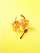 Melon granita with fried ham in two glass cups